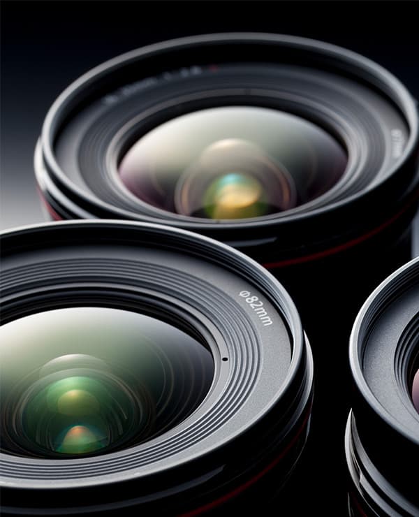 Engineer adjusting M12 lens on machine vision camera